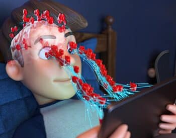 a person laying in a bed with a tablet