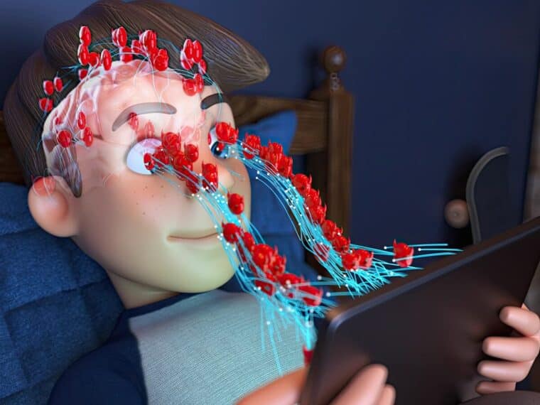 a person laying in a bed with a tablet