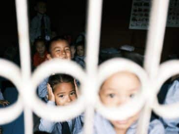 a group of young children standing next to each other