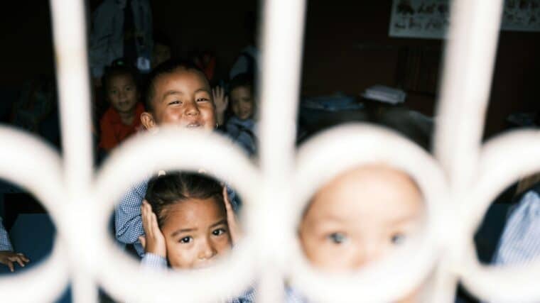 a group of young children standing next to each other