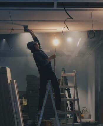 man on white ladder